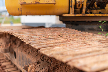 Heavy machinery operation at construction site close-up of excavator tracks urban environment industrial view
