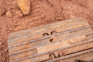 Excavation action construction site heavy machinery close-up earthy environment ground level view
