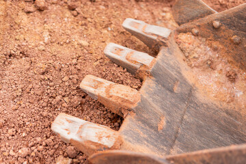 Excavation process construction site machinery close-up earth environment ground perspective