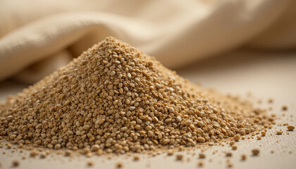 Sesame seeds are heaped on a wooden surface, showcasing their light brown color and small size. Perfect for adding flavor and nutrition to various dishes