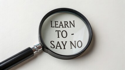 Magnifying glass showing the phrase Learn to Say No