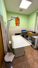 Sterile veterinary examination room, echoes of Saint Rocco's Day healing rituals, underutilized medical sanctuary, equinox wellness ethos April 5 2025, Barcelona, Spain