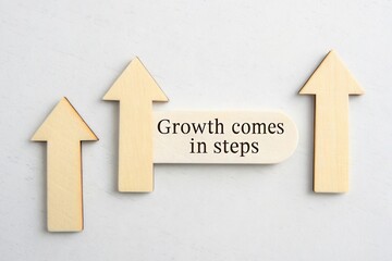 Wooden arrows representing growth and upward movement