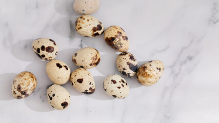 Quail eggs on sleek marble, evoking rustic Easter brunch, fertility symbols, and gastropub chic vibes April 5, 2025, Barcelona, Spain