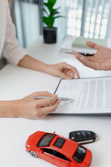 Business negotiation for car purchase shown with toy car models, car keys, calculator, and contract agreement. The images illustrate consultation, signing process, and financial decision.