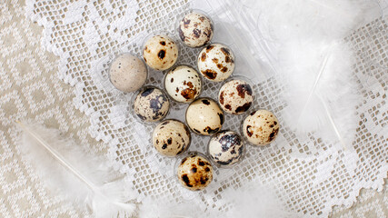 Speckled quail eggs nestle on delicate lace, embodying rustic elegance and invoking World Egg Day...