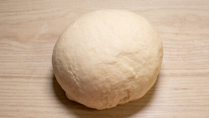 A plump dough sphere awaits transformation, whispering tales of ancient breadcraft and the magic of World Flour Day April 5, 2025, Barcelona, Spain