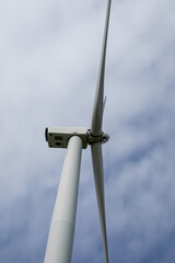 Towering wind turbine pierces sky, embracing renewable whispers of Gaia's breath; Earth Day tribute, Siete Dolores April 5 2025, Barcelona, Spain