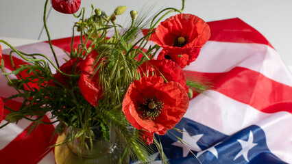 Vibrant poppies, echoing Memorial Days poignant whispers, entwine with stars and stripes; a floral homage of remembrance April 5 2025, Barcelona, Spain