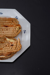 Sandwiches made of homemade bread toasted with ham, spreadable cheese and ketchup inside. Homemade food that is always good to start or end the day.