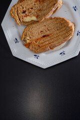 Sandwiches made of homemade bread toasted with ham, spreadable cheese and ketchup inside. Homemade food that is always good to start or end the day.