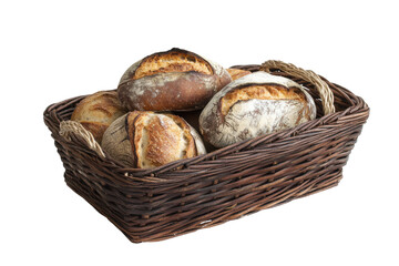 Rustic wicker basket filled with freshly baked sourdough bread loaves isolated on transparent background. Basket with assorted bread loaves isolated on white background.