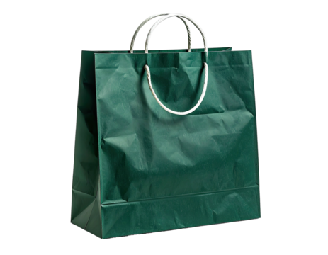 A green paper shopping bag with white rope handles, standing against black