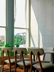 Modern cafe interior with sunlight streaming through window