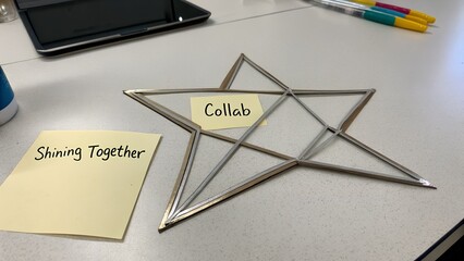 Star shaped object with Collab and Together sticky notes