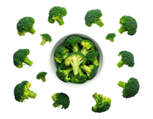 Fresh green broccoli florets surround a bowl, set against a stark black background