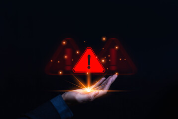 Cyber security warning alert icon with exclamation mark floating above hand, concept of danger, risk management, data protection, error, technology problem, digital safety in business environment.