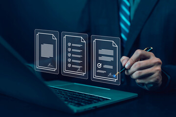 Businessman signing digital documents with e-signature on laptop, concept of paperless office, contract management, legal agreement, online form, business efficiency, secure electronic documentation.