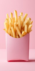 golden french fries in a pink carton