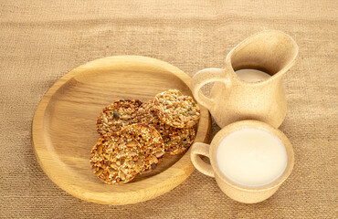 Thaler cookies with nuts and honey, on jute cloth, close-up.