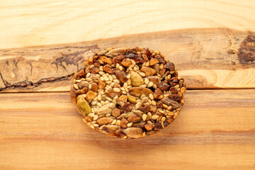 Thaler cookies with nuts and honey, on a wooden table, close-up.