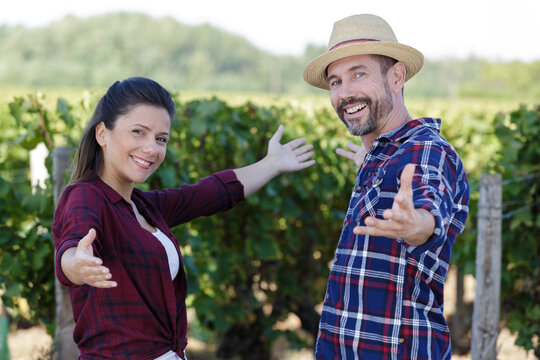 portrait of happy couple at vineyard on sunny day
