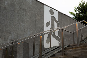 Staircase with clear pedestrian sign, symbolizing convenience and functionality in urban design....
