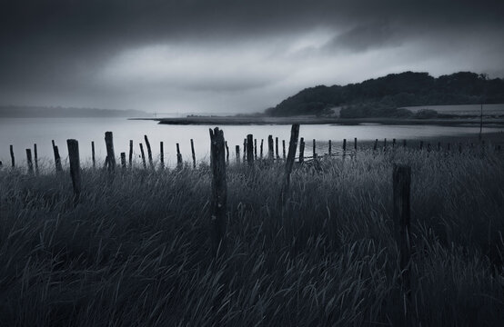Storm clouds over marshland along an Estuary, Mordreuc, Dinan, Cotes-d'Armor, Brittany, France