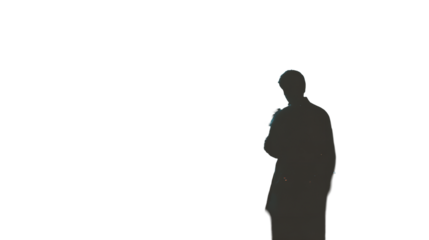 Enigmatic Silhouette: A Man's Quiet Reflection in the Darkness Unveiling a Mysterious Figure
