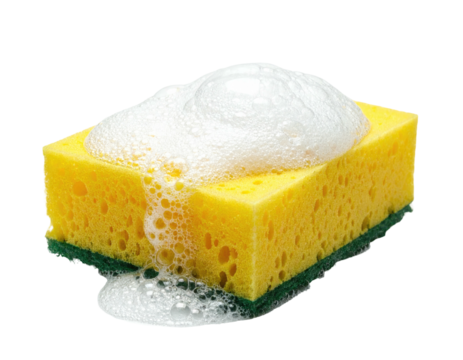 A rectangular sponge with foamy suds on top and dripping down
