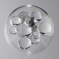 Clear liquid droplets suspended in a larger glass sphere. 3d rendering skincare innovation, beauty product ingredients background.