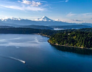 Scenic aerial view of a bay with a snow-capped mountain in the background
