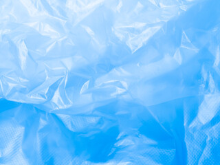 Obraz premium Abstract background plastic bag blue vacuum cling foil wrinkle texture wall crumpled film foil overlay seal wrap polyethyene packaging frame material industry wrinkle template ecosystem environment