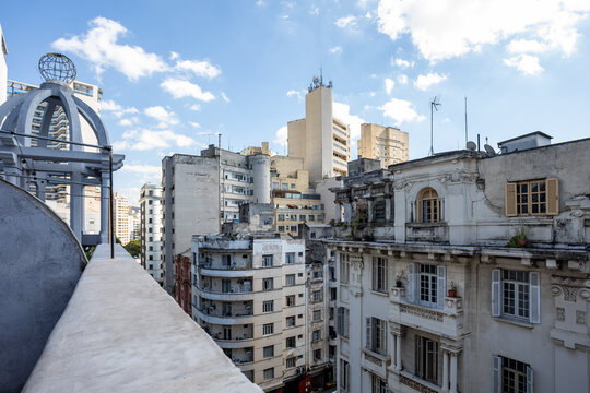 View from a rooftop showing the dense urban landscape and eclectic mix of architectural styles in Sao Paulo, Brazil