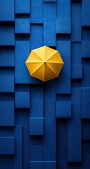 Yellow umbrella atop a textured blue block surface
