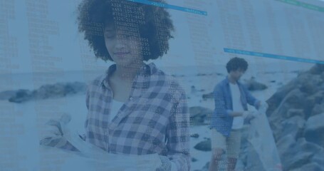 Volunteers inspecting mesh sheet and collecting debris while data overlays tracking coastal cleanup - Powered by Adobe