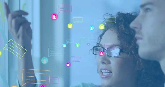 Watch hand pointing on panel starting floating user icons around team on tech visualization