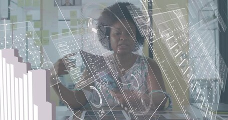 Data analyst picking up sheets and arranging as animated analytics charts updating for analysis - Powered by Adobe