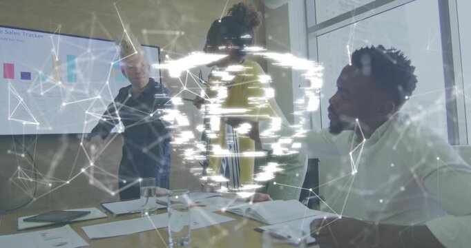 Presenter gesturing mesh forming padlock shield icon with colleagues referencing sales charts