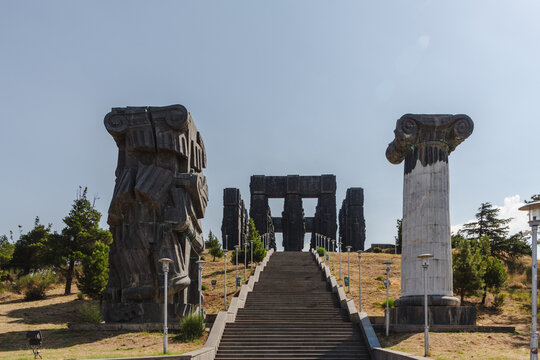 View of the Chronicles of Georgia monument, a striking assembly of colossal pillars ascending into the sky, a testament to history etched in stone, Tbilisi, Georgia.