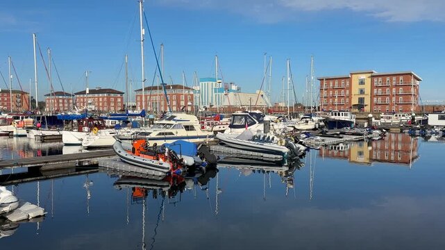Aerial drone video of Hartlepool North East England UK coastal town with marina, harbour, and seaside urban landscape