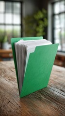 Green Folder with White Sheets on Rustic Wooden Surface