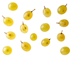 Scattered translucent green grapes, some halved, on black background