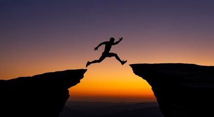 Silhouette of person leaping across gap against sunset sky
