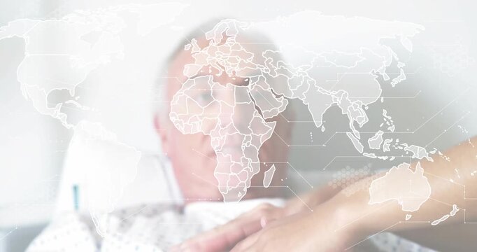 Patient lying bed getting health monitoring sensor band as nurse wiping forehead, world map overlay