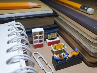 Mini toy of action figure at table with blurred background. Miniature photography concept design....