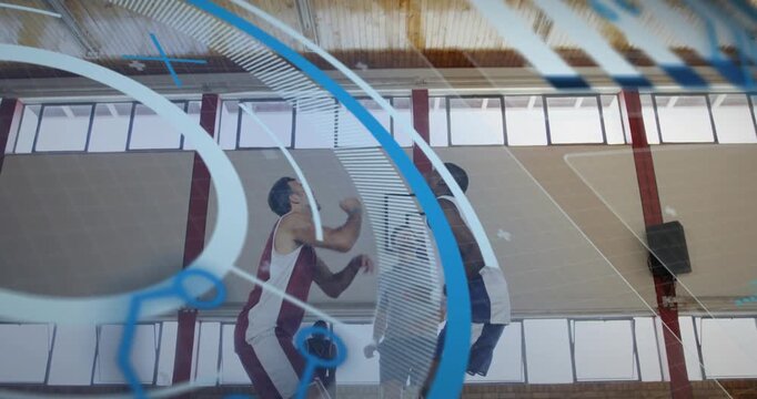 Referee tossing ball overhead for tip-off as two rivals jumping with digital sports stats on court
