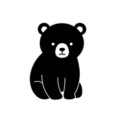 Cute black bear cub sitting and looking forward. © Dira