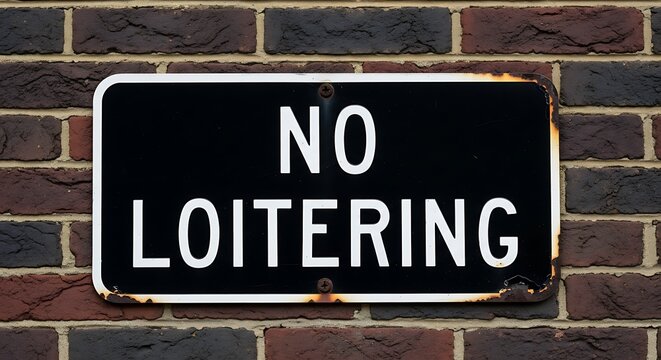 No Loitering Sign on Brick Wall