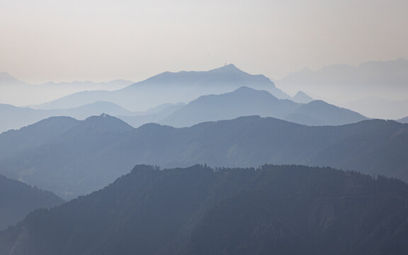 View of majestic mountain ranges fade into the hazy distance, their peaks softened by the atmosphere, Goldeck, K&Atilde;&curren;rnten, Austria.